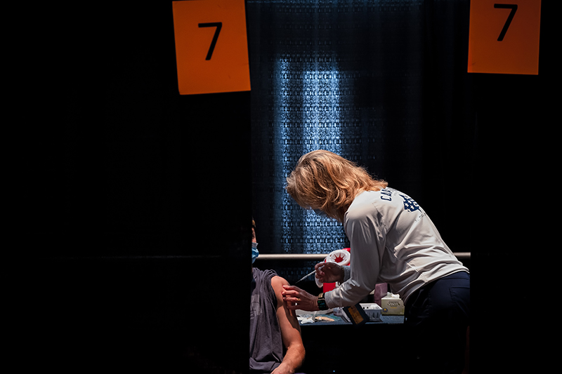 Kymberlee Montgomery, DNP, a clinical professor of nursing and senior associate dean of nursing and student affairs, administers Pfizer vaccines at an April 19 vaccination clinic at Drexel University.